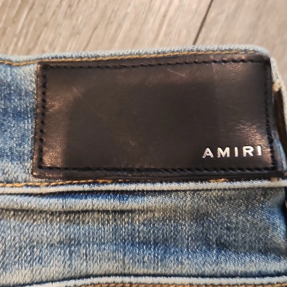 AMIRI Blue and White Skinny Jeans with Distressed Details